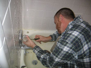 Tom Walker fixing a tub